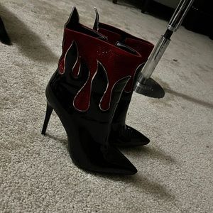 Red and black stiletto heel boots, size 9.